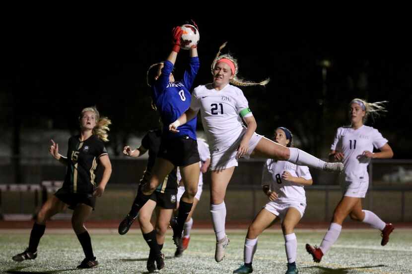 Birdville's goalie Michele Snow (0) jumps to catch the ball against Grapevine's Sophie Smith...