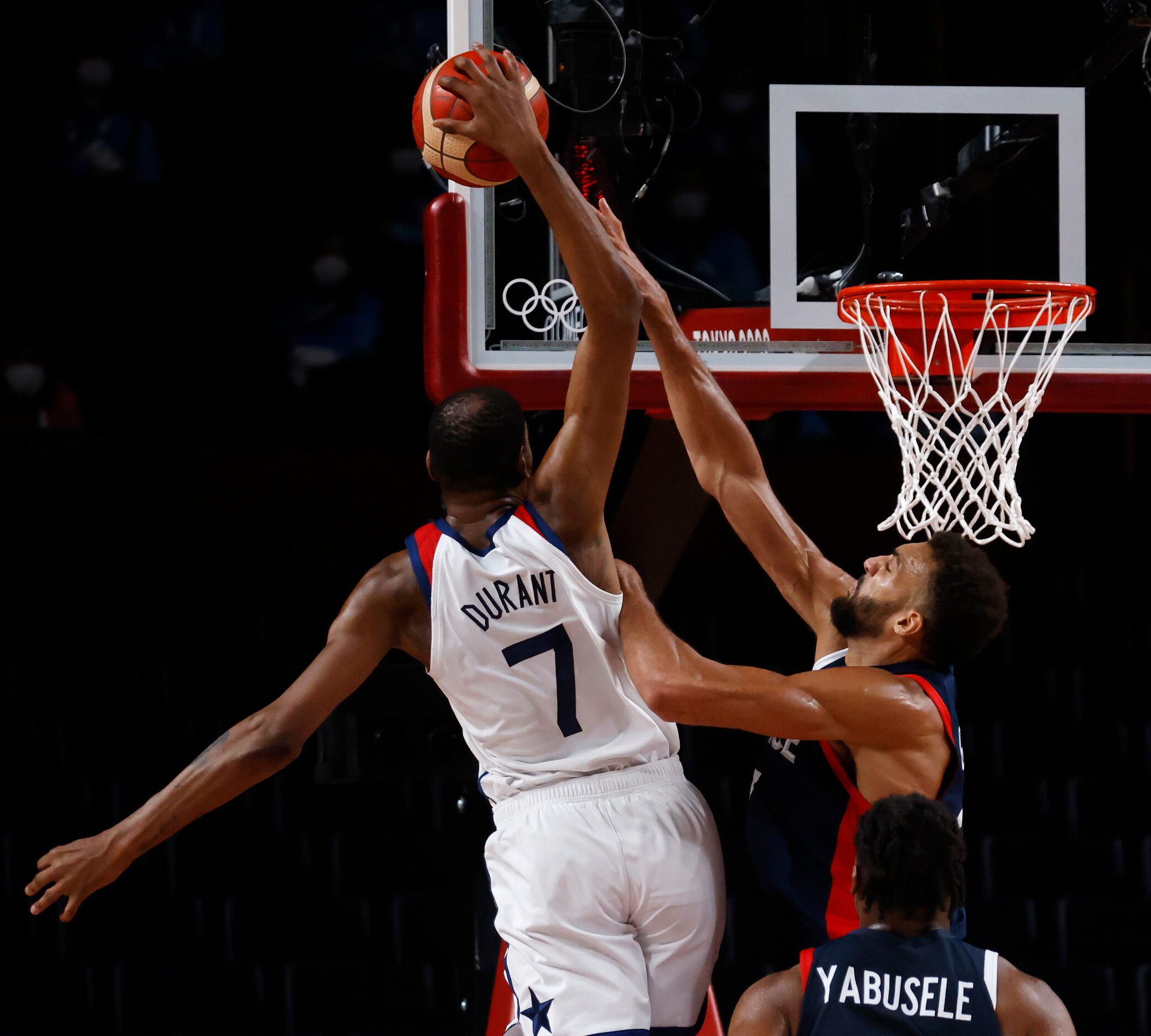 USA’s Kevin Durant (7) is fouled by France’s Rudy Gobert (27) on a shot attempt during the...