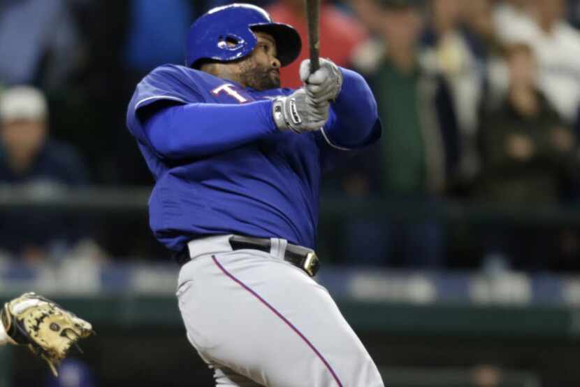 Texas Rangers' Prince Fielder hits a solo home run off Seattle Mariners' Steve Cishek during...