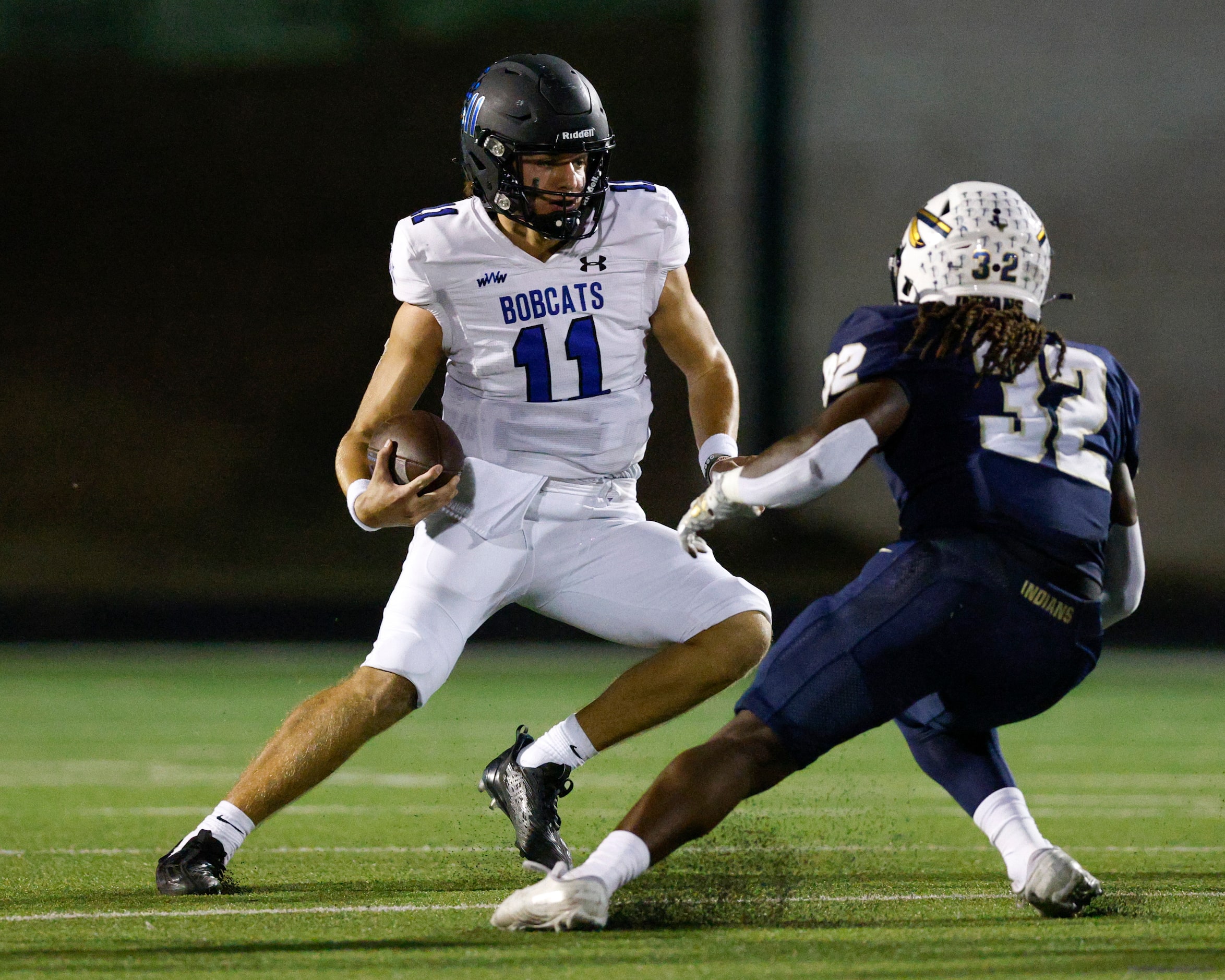 Trophy Club Byron Nelson quarterback Jake Wilson (11) cuts around Keller linebacker Nate...