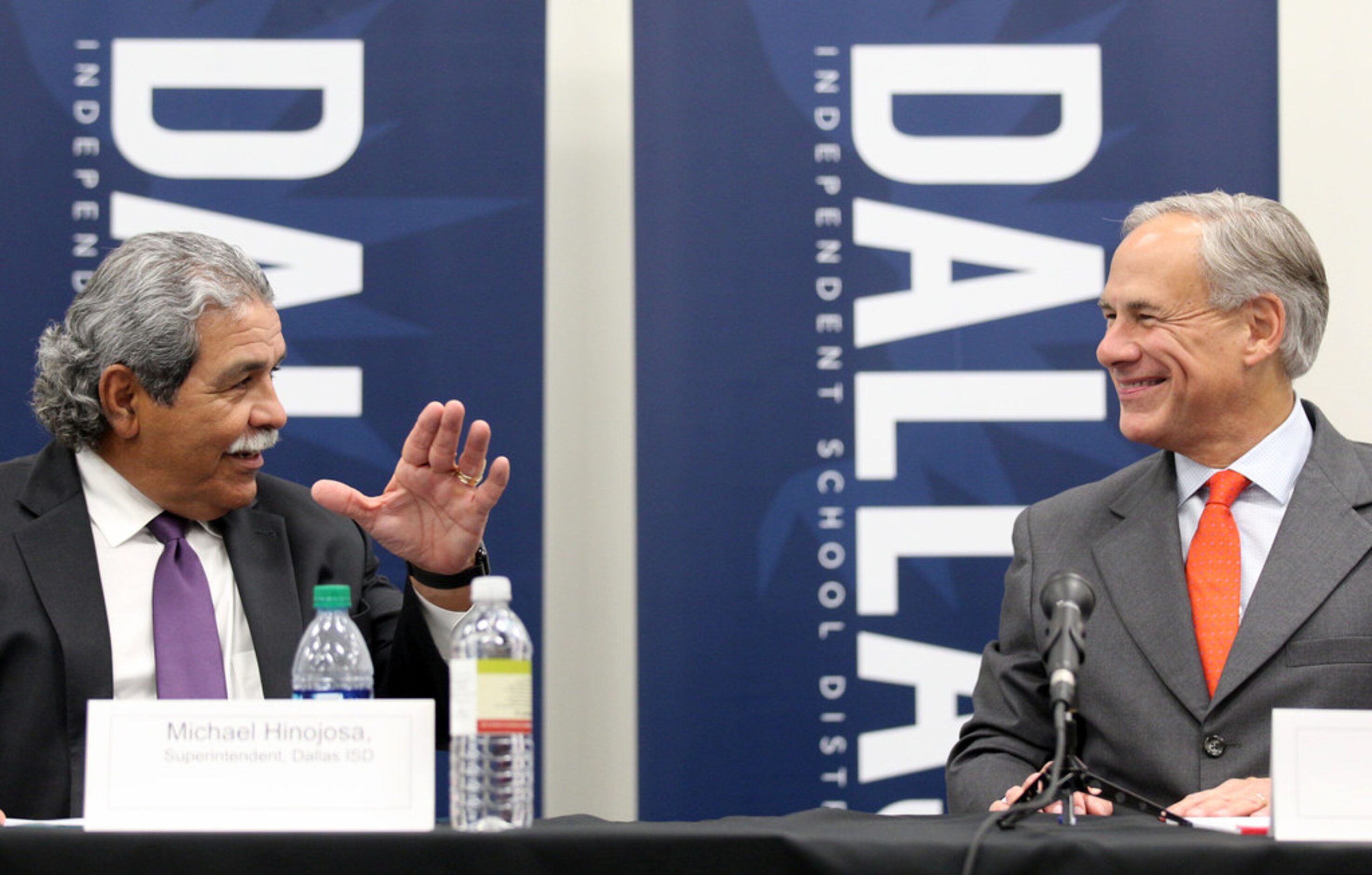 Dallas ISD Superintendent Michael Hinojosa, left, and Governor Greg Abbott meet with...