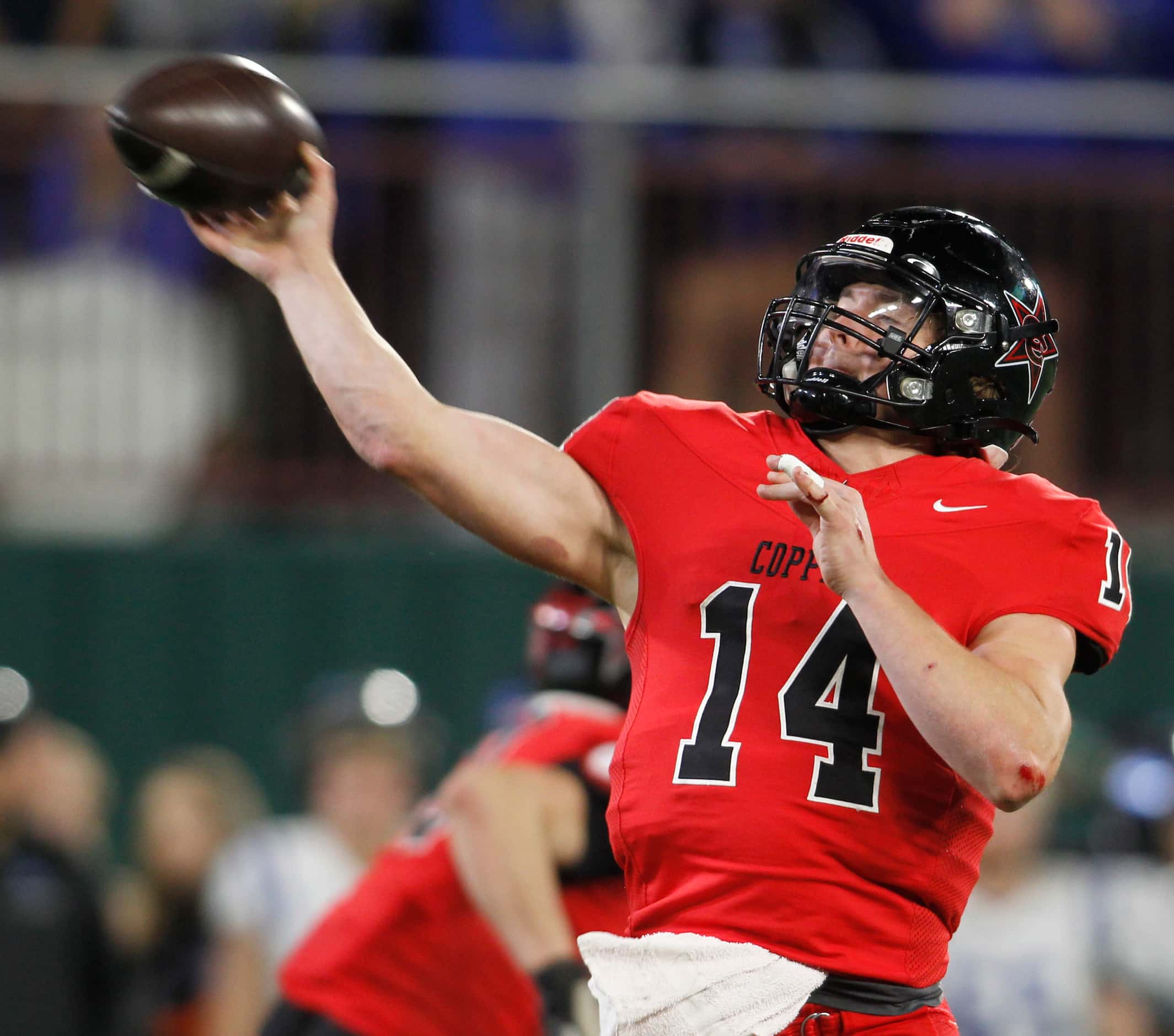 Coppell quarterback edward Griffin (14) launches a touchdown pass during the 4th quarter of...
