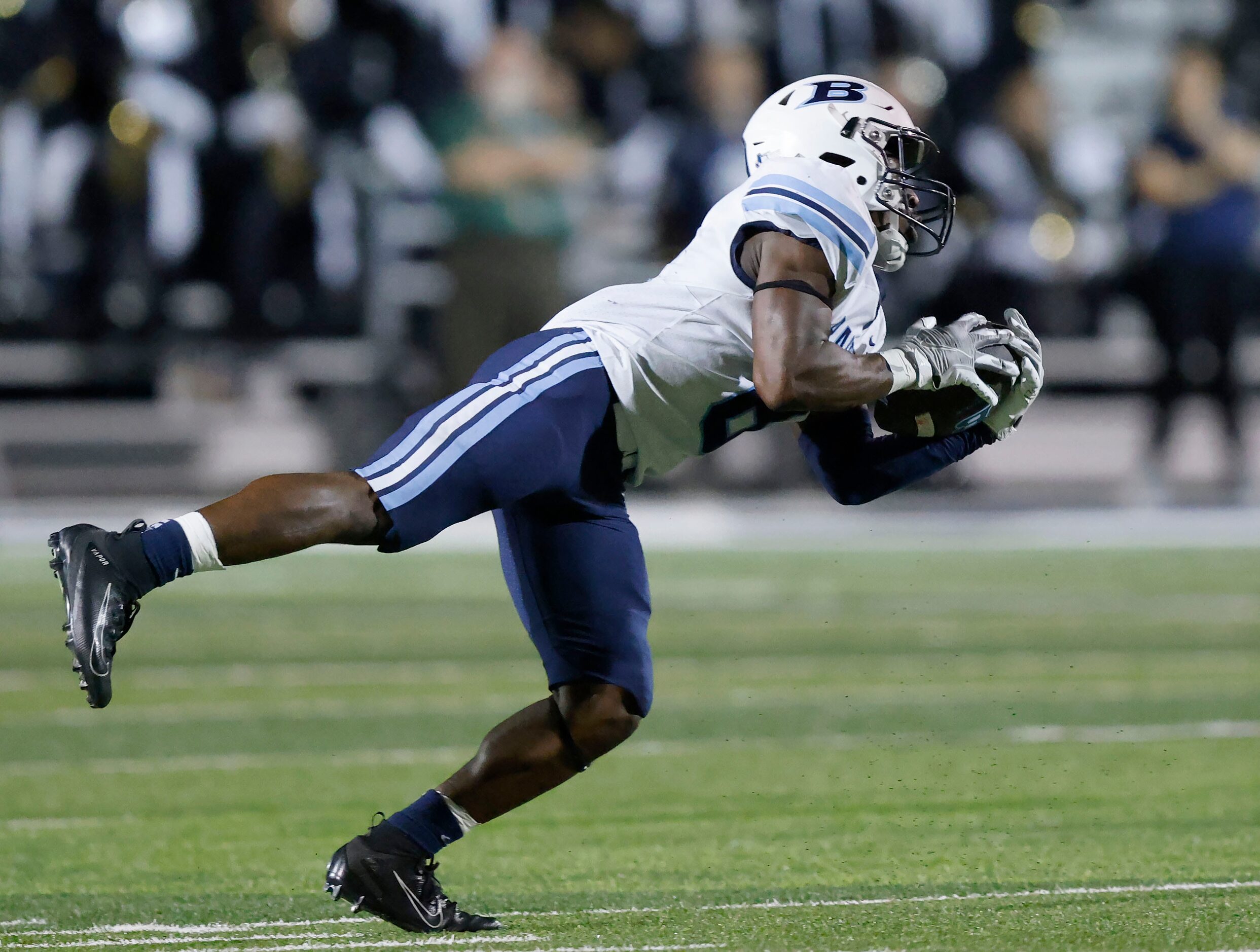 Hurst L.D. Bell running back Gracien Anto (8) reaches for a first quarter pass completion...