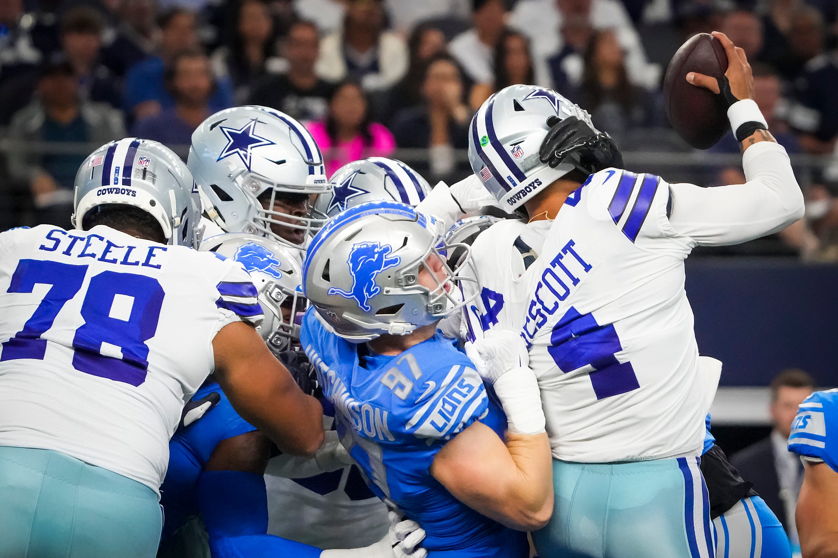 Dallas Cowboys quarterback Dak Prescott (4) is sacked by Detroit Lions defensive end Aidan...