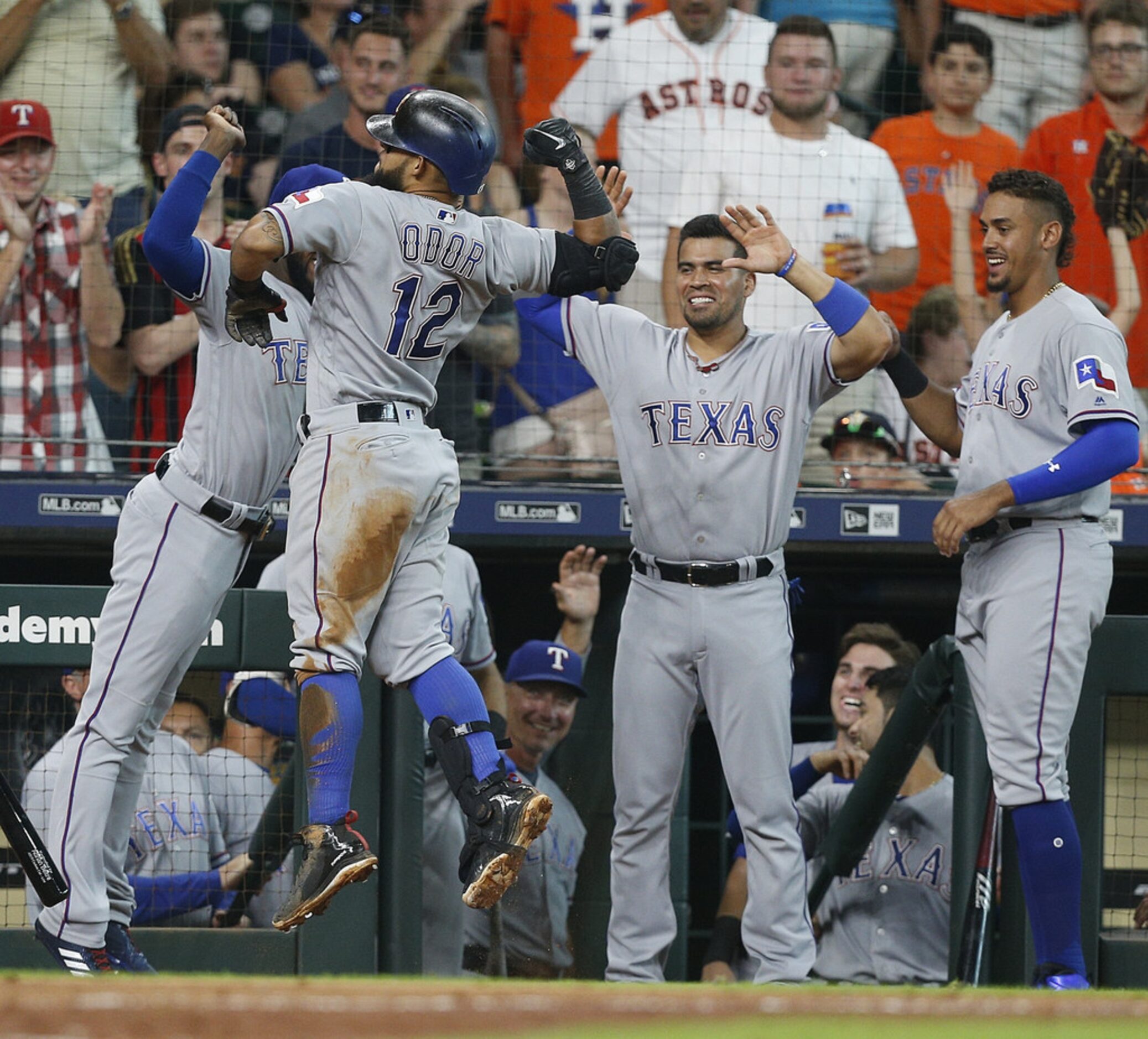 HOUSTON, TX - JULY 28:  Rougned Odor #12 of the Texas Rangers celebrates with Jurickson...