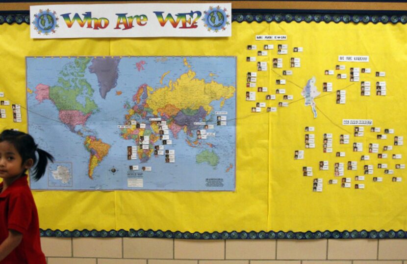 A world map displays photos of students and their country of origin in a main hallway at...