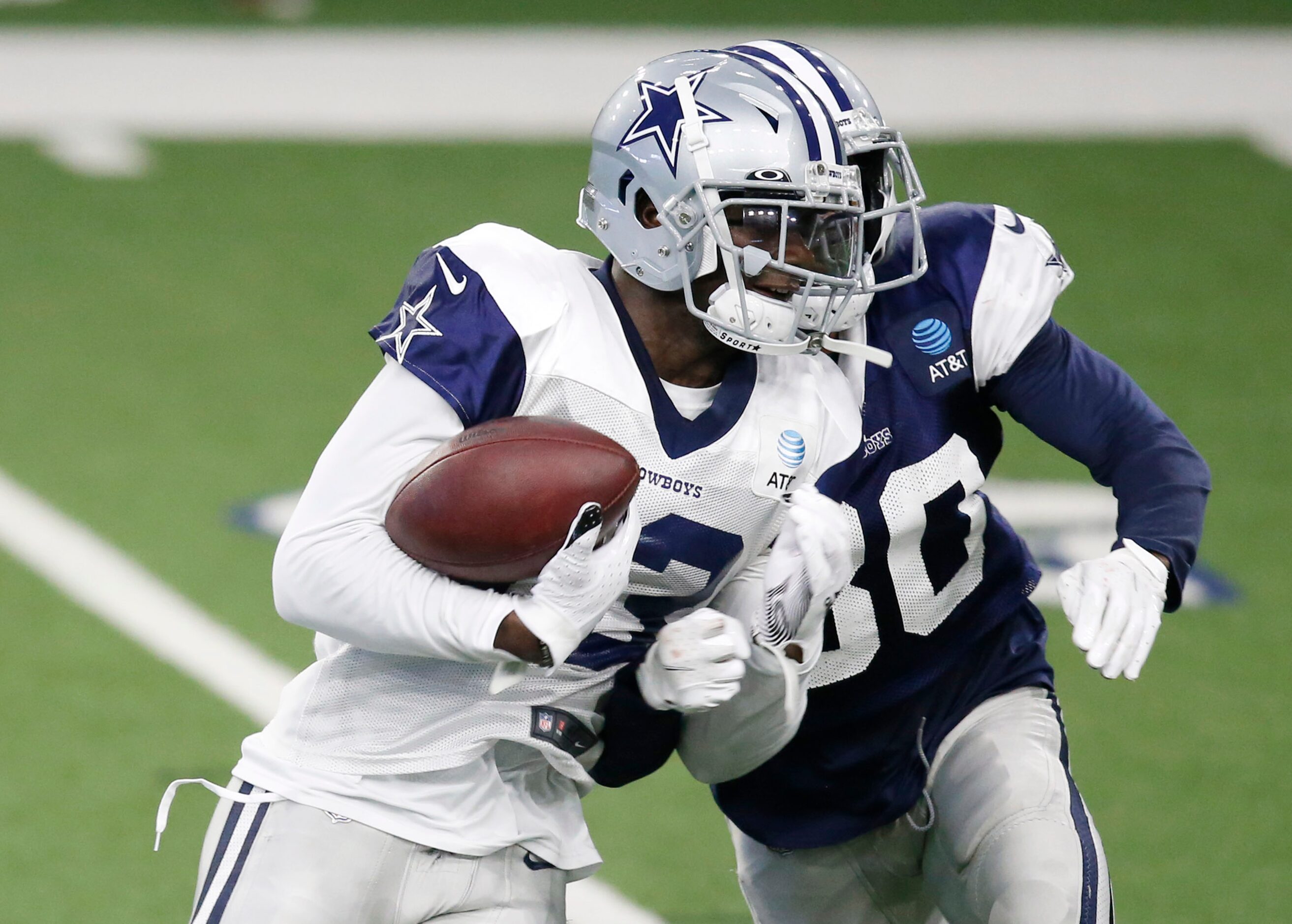 Dallas Cowboys cornerback Anthony Brown (30) punches the ball out of the hands of Dallas...