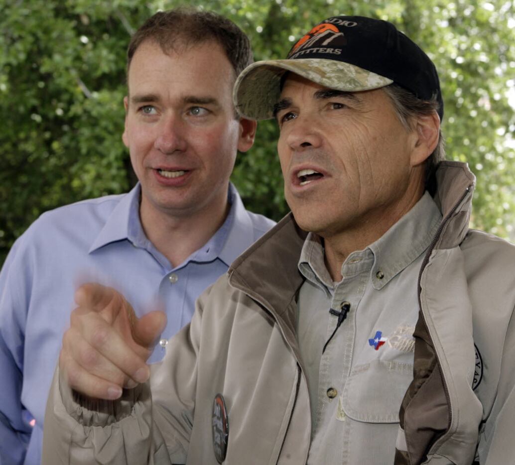 Michael Quinn Sullivan talks with Texas Gov. Rick Perry before Perry's address to a "Don't...