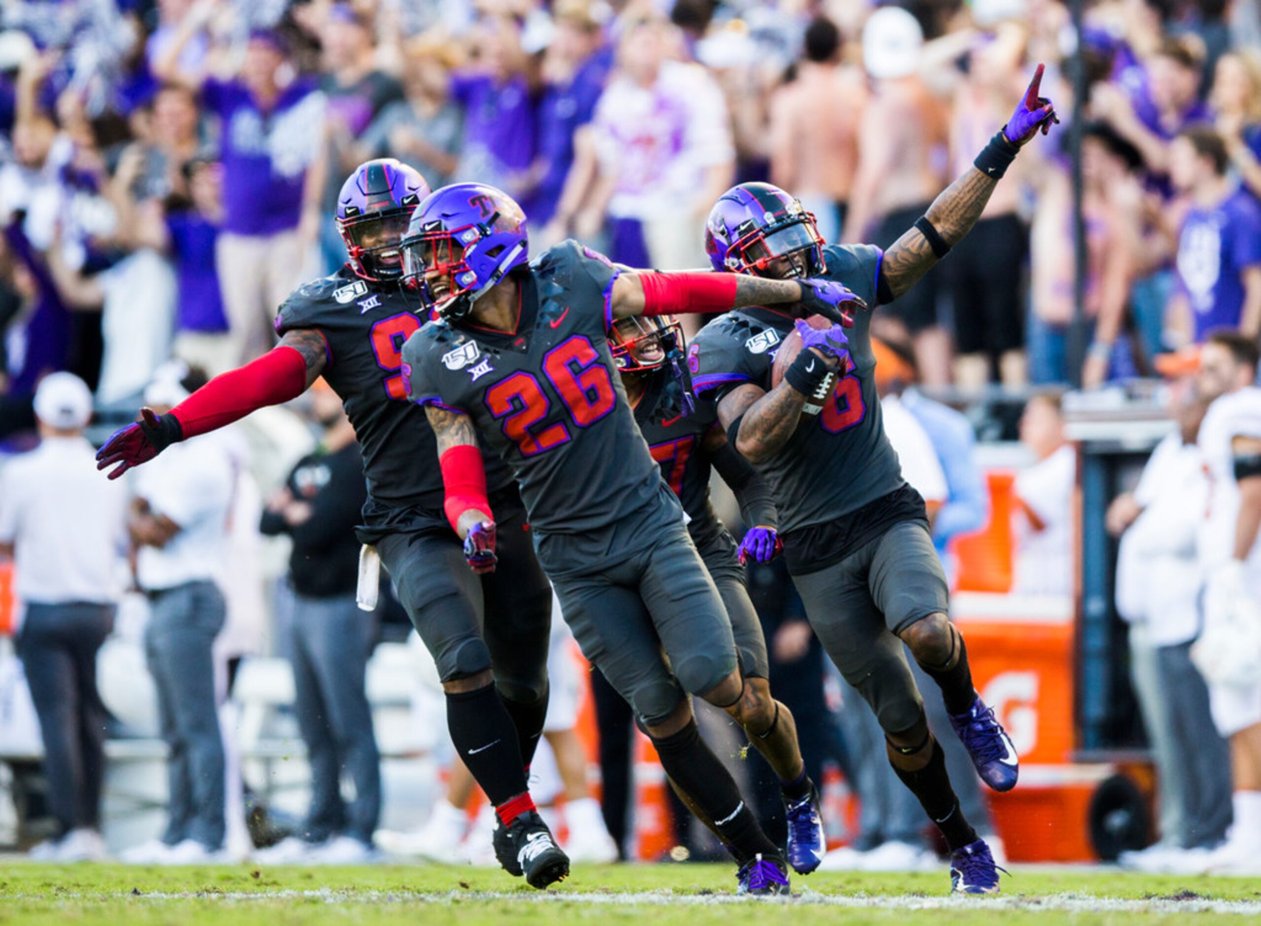 TCU Horned Frogs celebrate after safety Innis Gaines (6) caught an interception that...