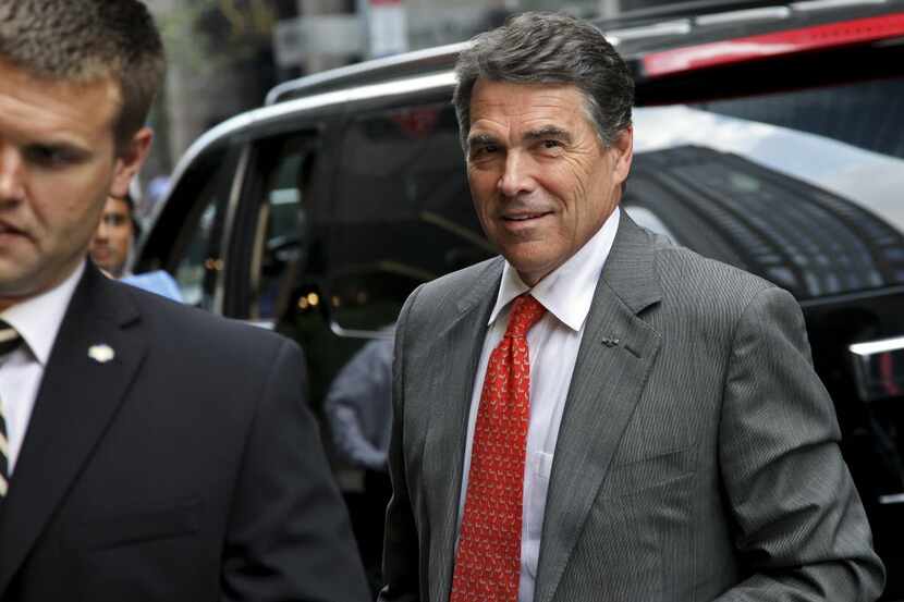  Then-Gov. Rick Perry arrived at Trump Tower in New York for a meeting with Donald Trump in...