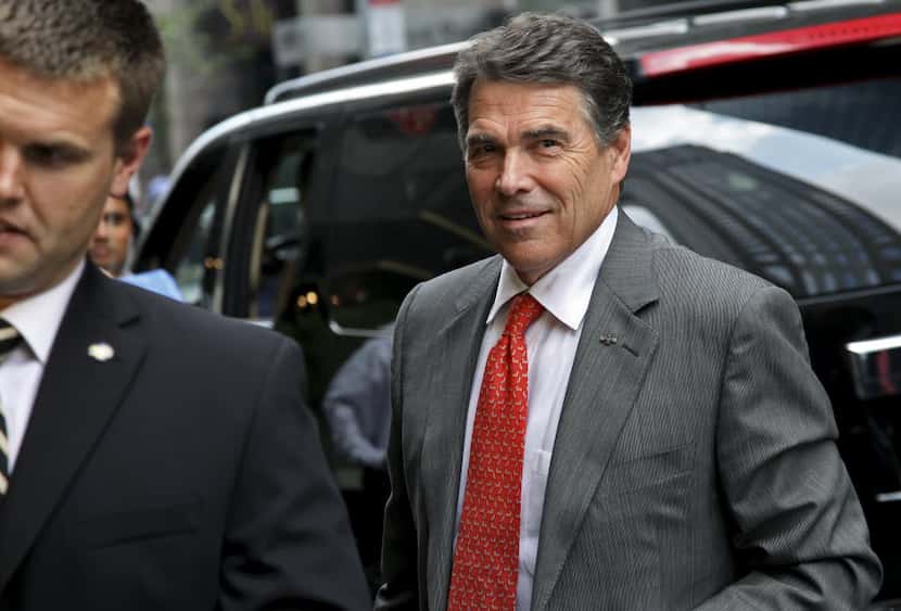  Then-Gov. Rick Perry arrived at Trump Tower in New York for a meeting with Donald Trump in...