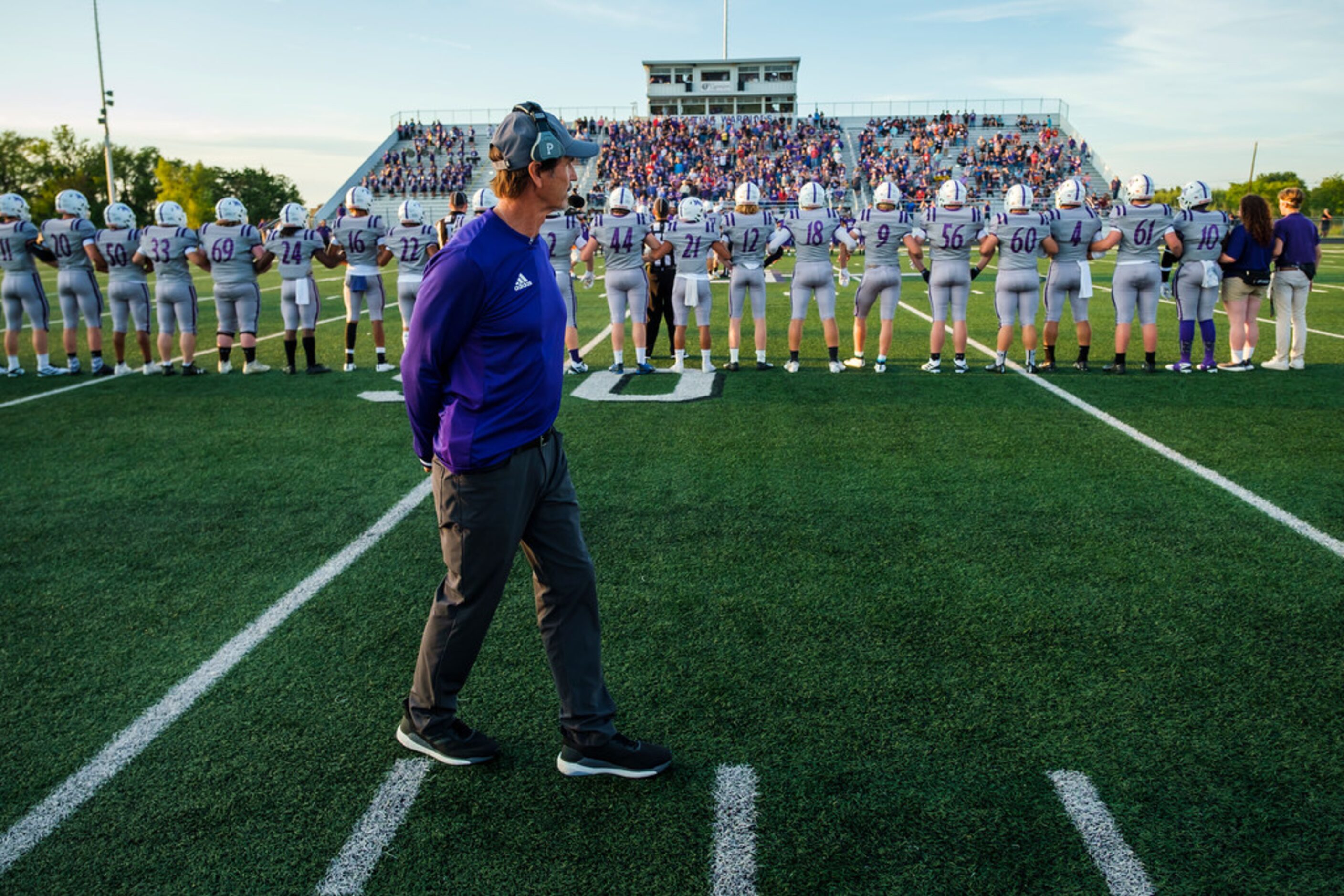 Mount Vernon high school football coach Art Briles lines up on the sideline before his...