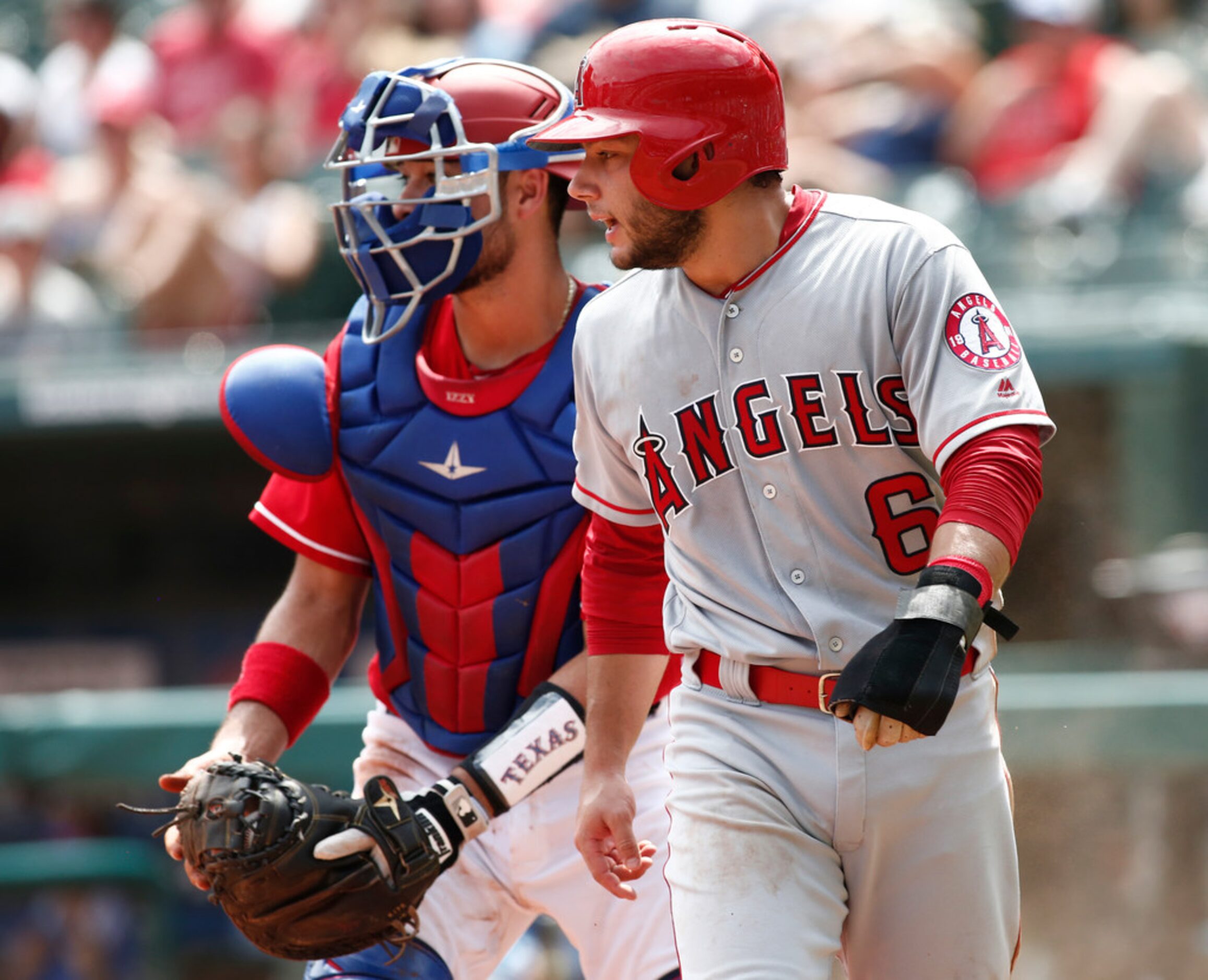 Los Angeles Angels' David Fletcher (6) reacts after scoring a run as Texas Rangers shortstop...