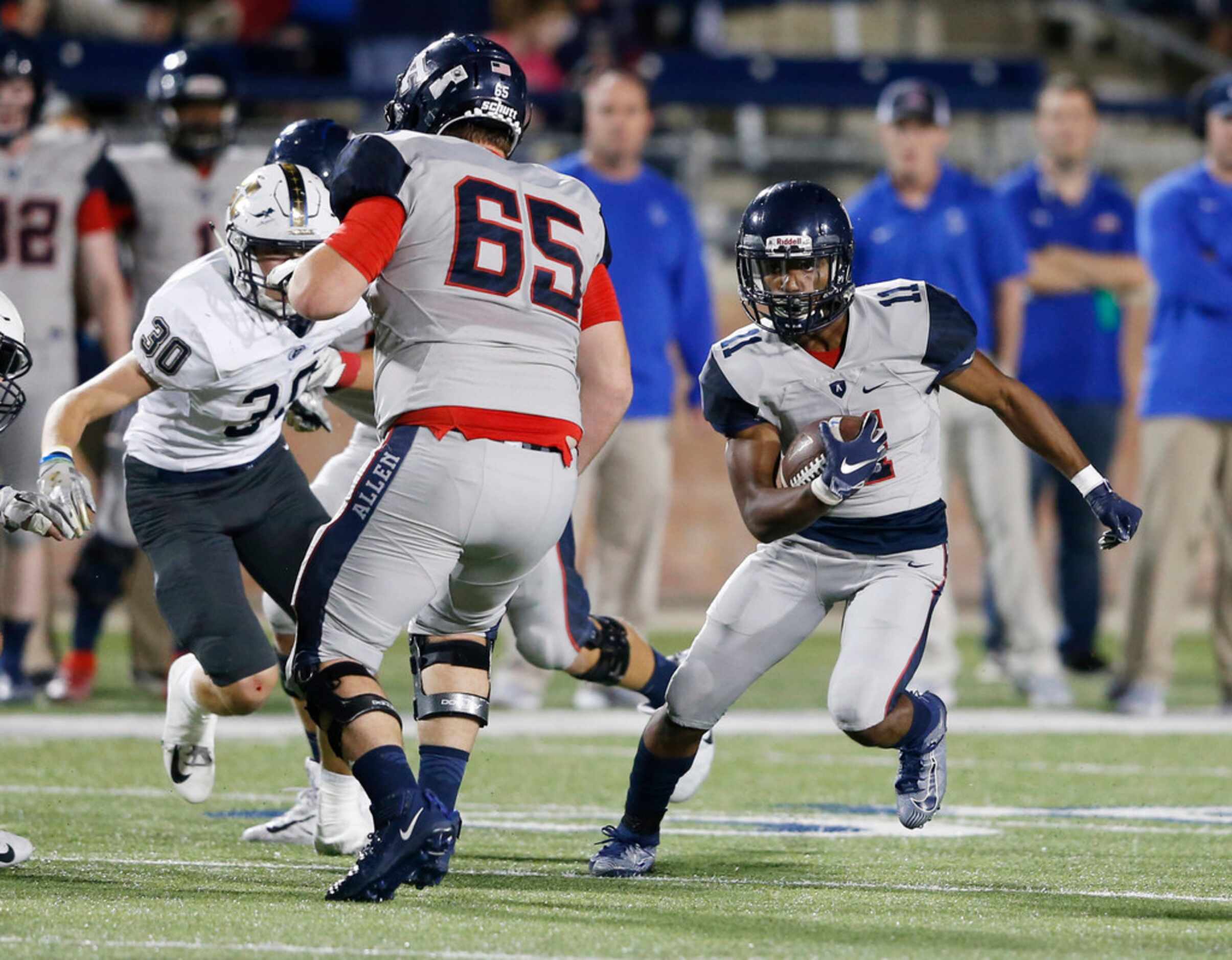 Allen's Jordan Johnson (11) runs up the field in a game against Jesuit during the first half...