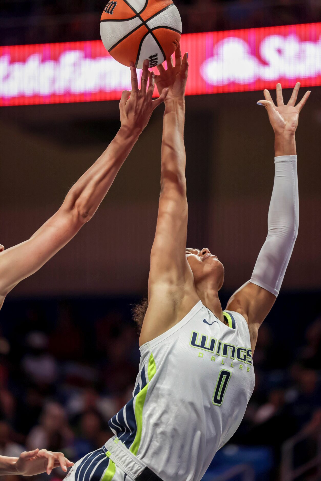 The ball is knocked from the fingertips of Dallas Wings forward Satou Sabally (0) by...