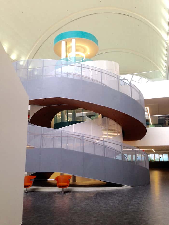 A curved central stair connects the levels of RealPage's Richardson office.
