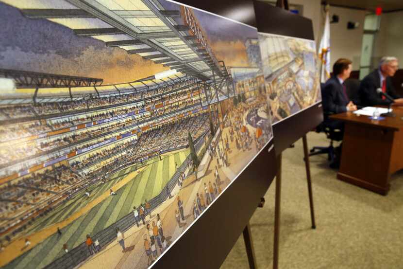 A rendering of the proposed new ballpark is on display as Arlington Mayor Jeff Williams and...