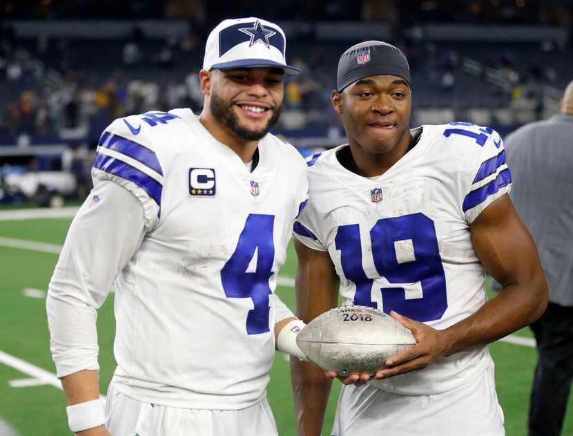 Dallas Cowboys quarterback Dak Prescott (4) and Dallas Cowboys wide receiver Amari Cooper...