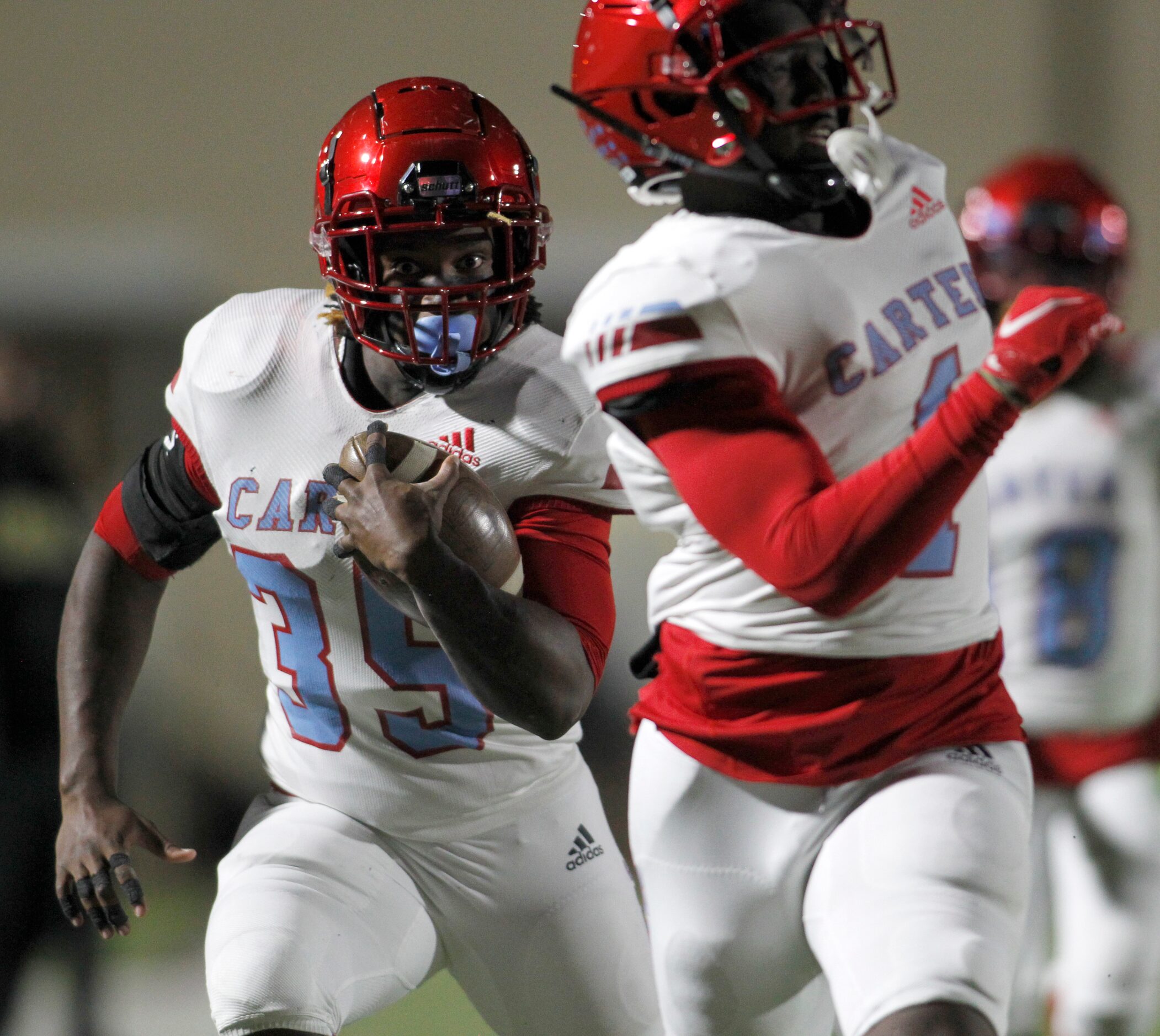 Dallas Carter linebacker Janari Hyder (35) returns a fumble he recovered as defensive...