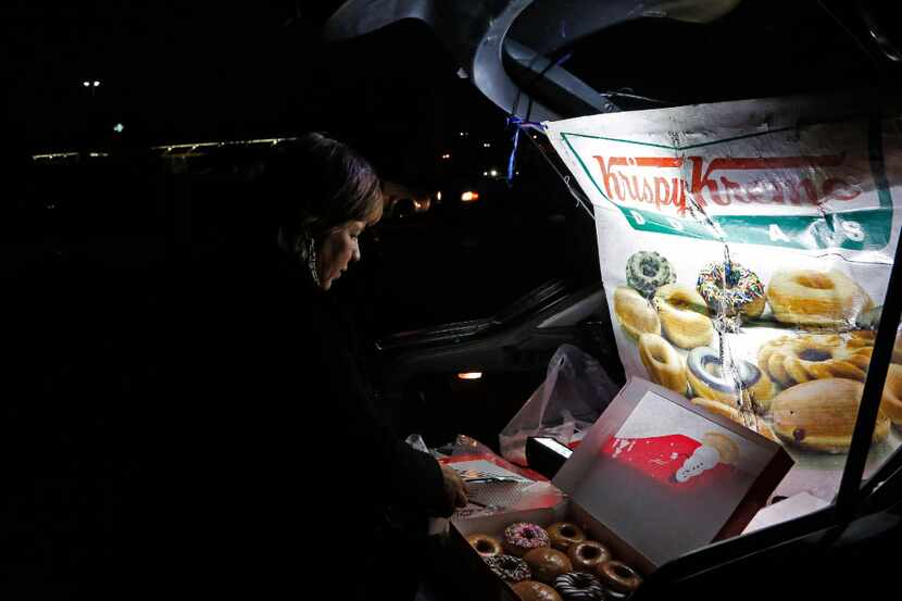 Sonia Garcia sells Krispy Kreme doughnuts, purchased across the border in El Paso, from the...
