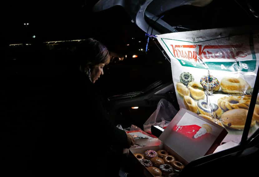 Sonia Garcia sells Krispy Kreme doughnuts, purchased across the border in El Paso, from the...