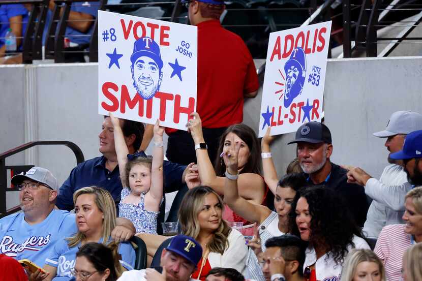 Young Texas Rangers fans encourage others to vote third baseman Josh Smith and outfielder...