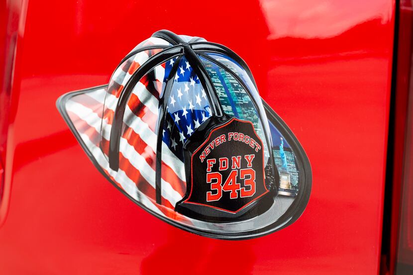A decal on the vehicle of Grapevine Fire Assistant Chief Stuart Grant is a memorial to those...