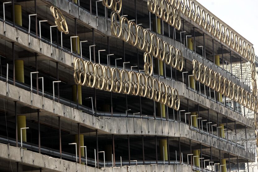 This 2005 photo shows the large rings that decorated a downtown parking garage that was...