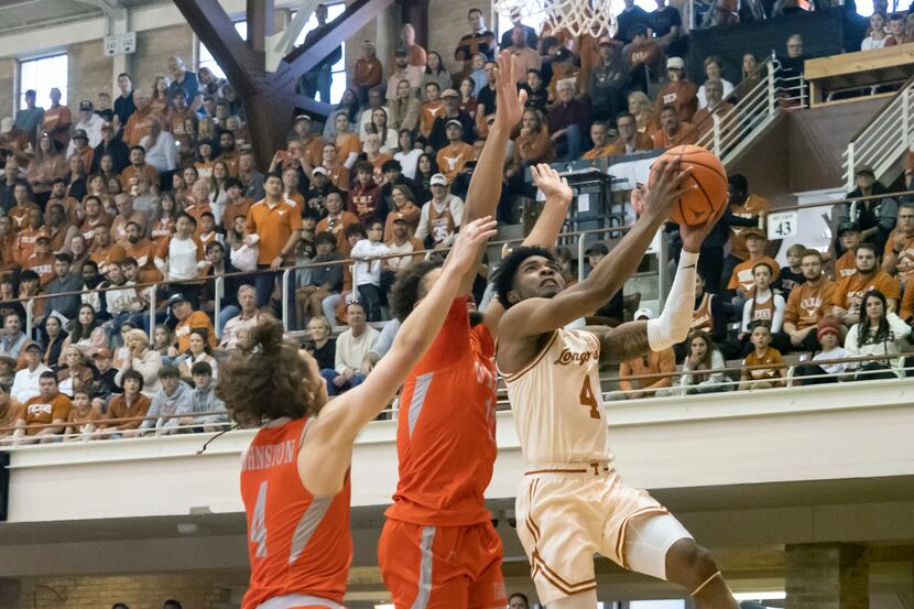Texas guard Tyrese Hunter (4) goes up to shoot against Texas Rio Grande Valley guard Will...