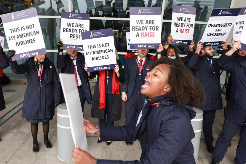 Kaila Gardner cheers to rally other flight attendants during an informational picket Tuesday...