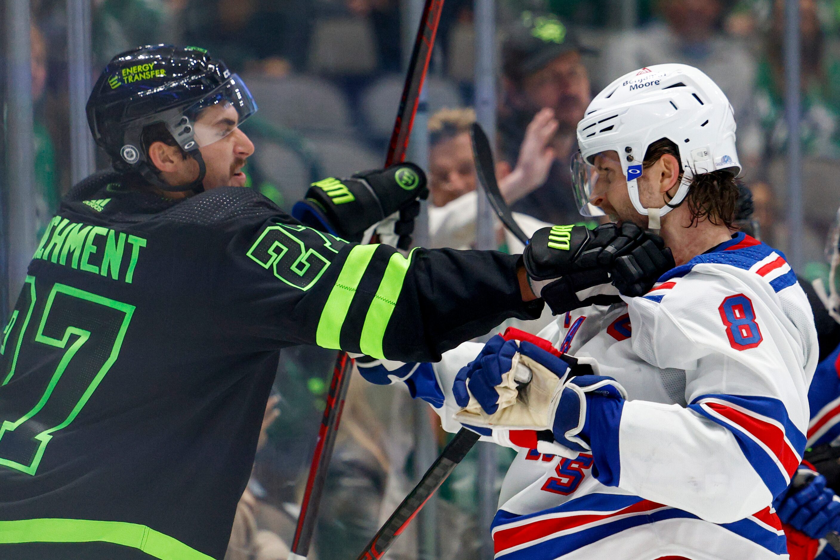 Dallas Stars left wing Mason Marchment (27) grabs a hold of New York Rangers defenseman...