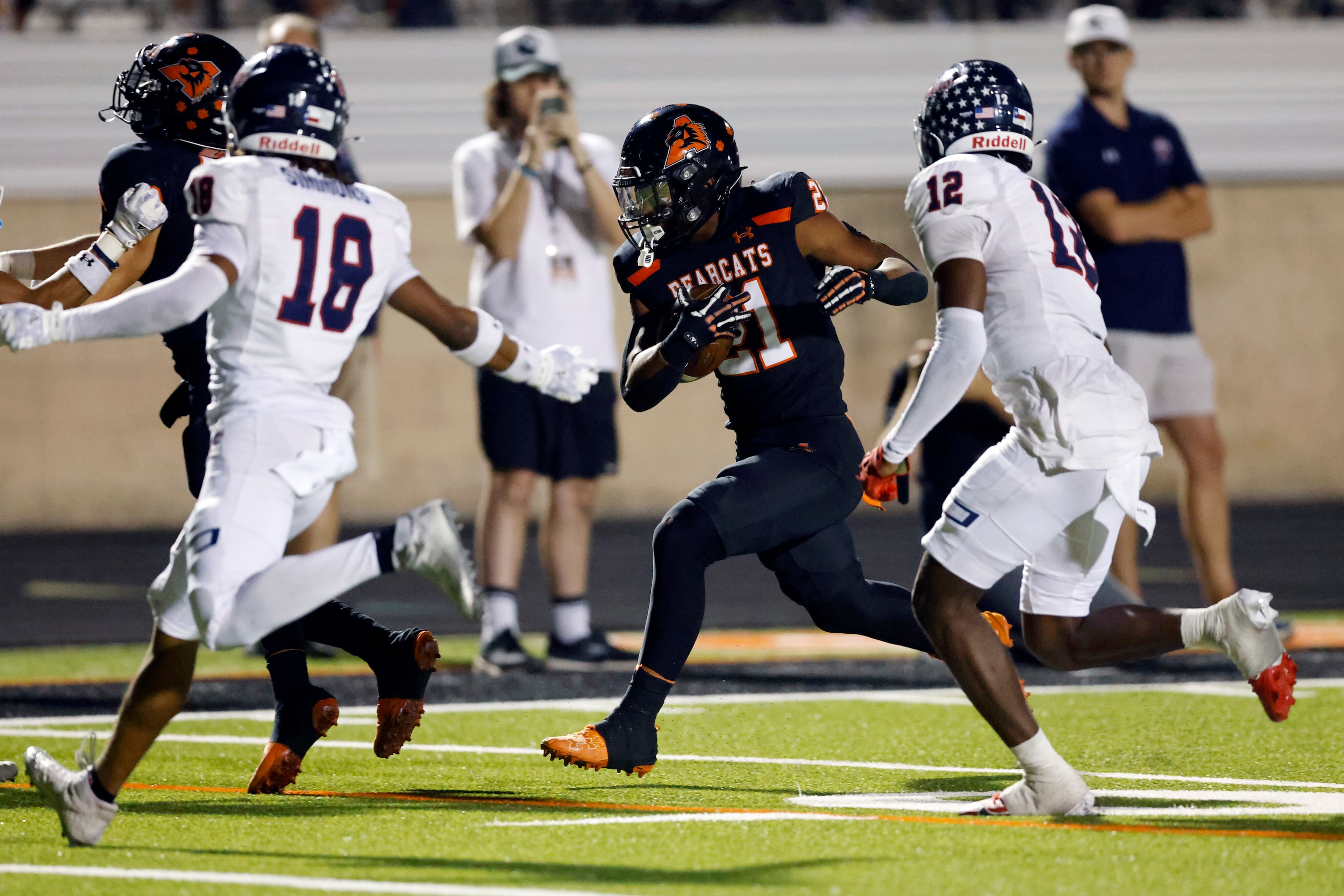 Aledo running back Kaden Winkfield (21) runs the ball as Denton Ryan running back Byran...