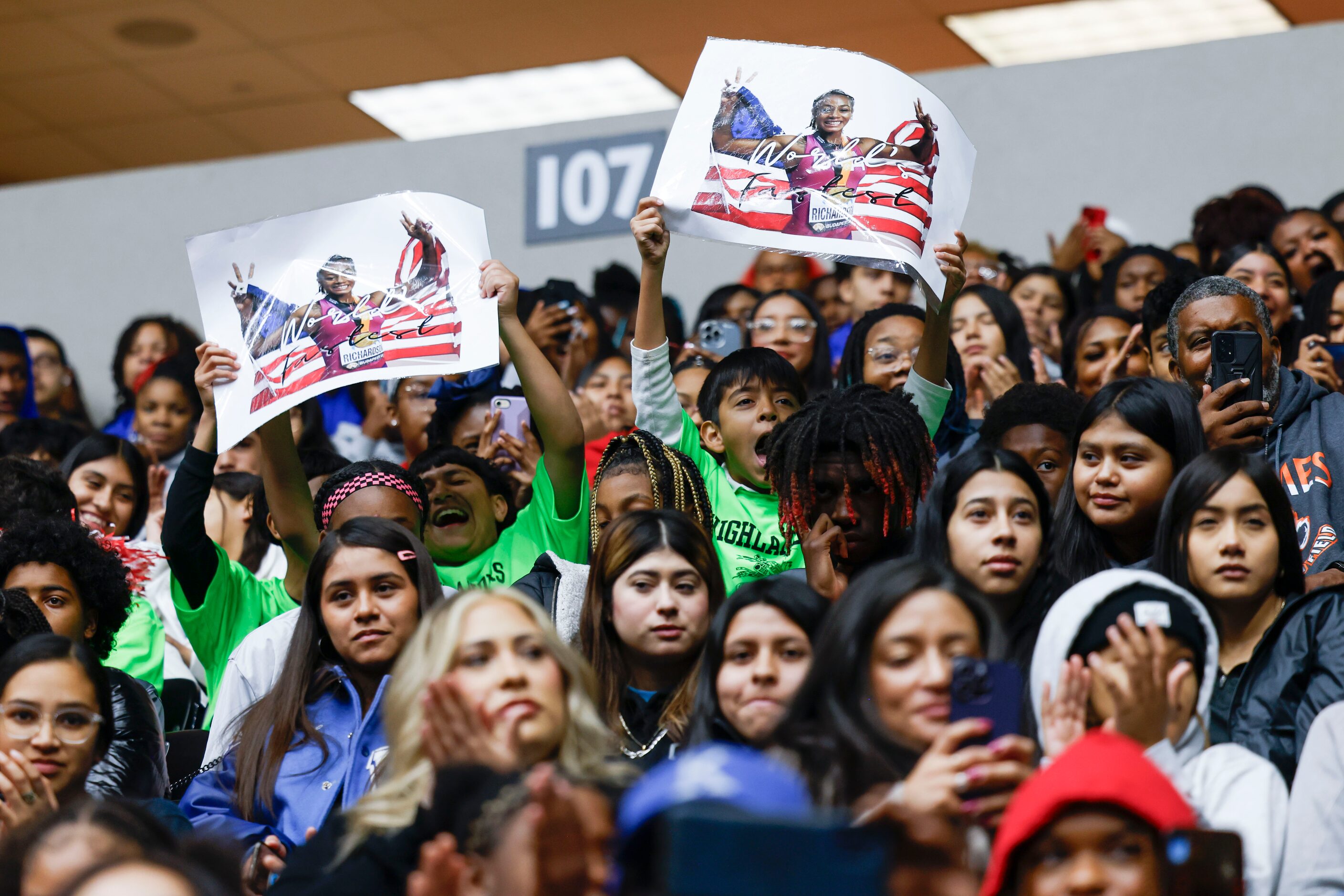 Student crowd cheers as 100 meters world champion Sha'Carri Richardson (not in the picture),...