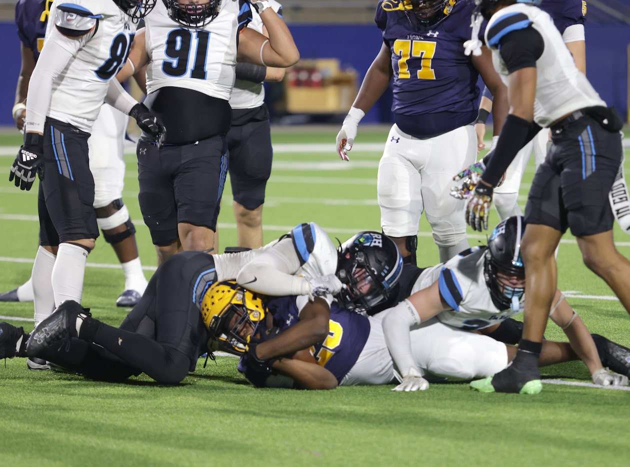 Rock Hill players pile onto McKinney player #25 Julian Joseph during the Prosper Rock Hill...