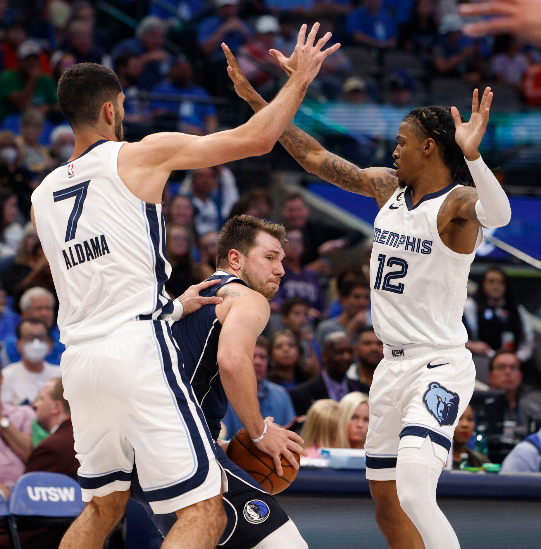 Memphis Grizzlies forward Santi Aldama (7) and guard Ja Morant (12) double team Dallas...