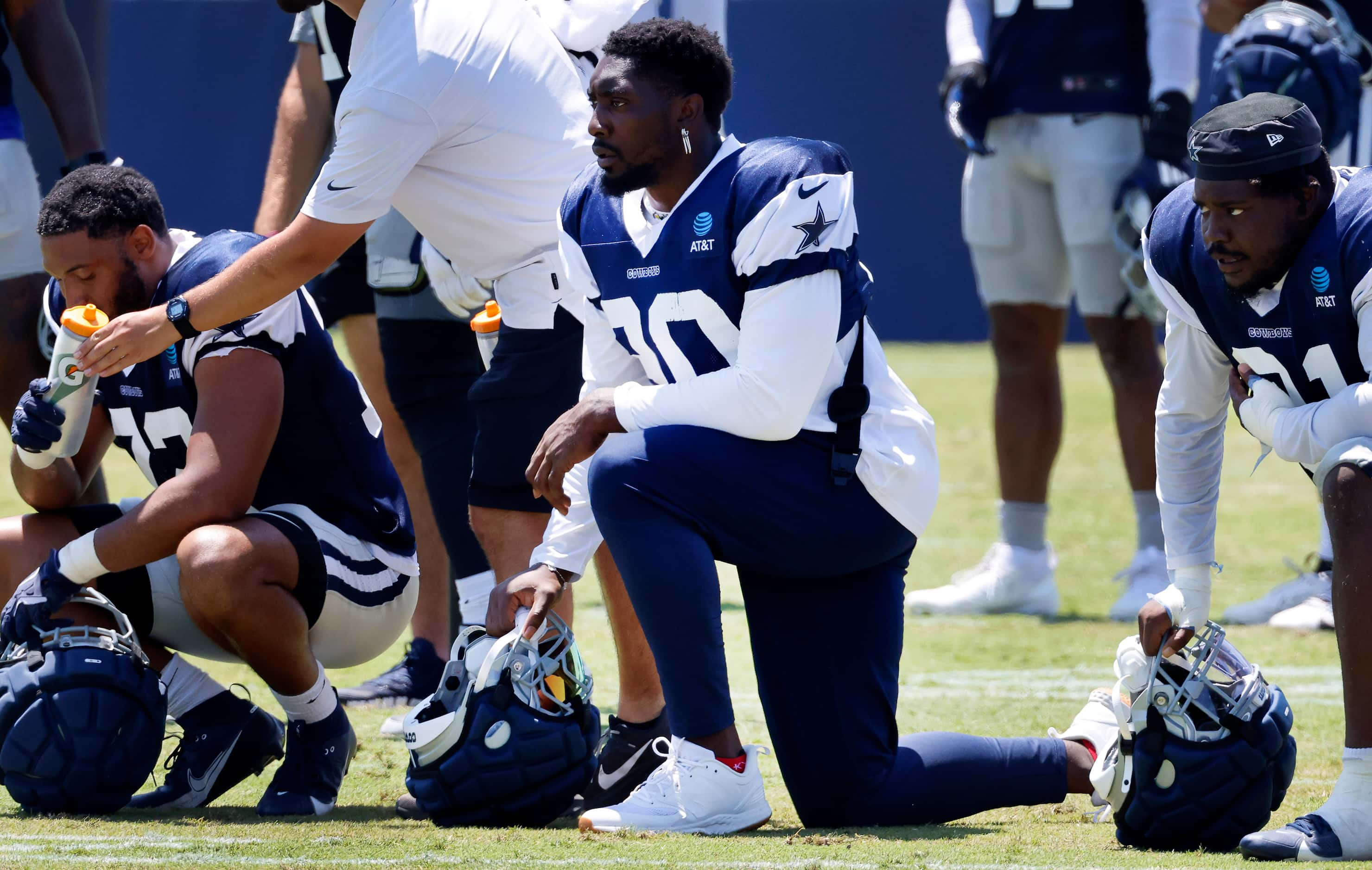 Dallas Cowboys defensive end DeMarcus Lawrence (90) watches the defense face the offense as...