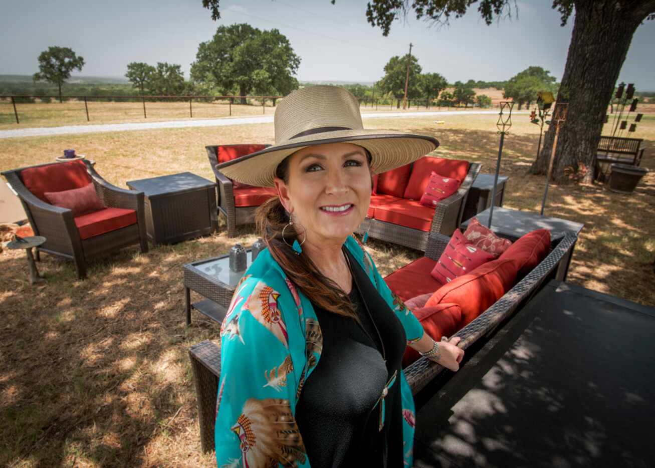 Melanie Newton, wife of Cowboy Chef Mike Newton, in the part of their yard where they...