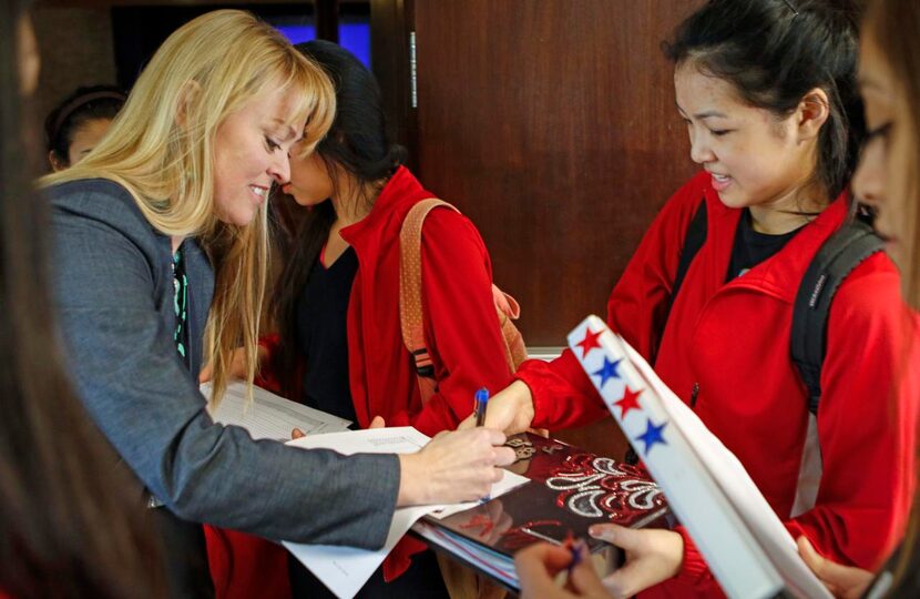 
Thomas Jefferson High School principal Sandi Massey signs an attendance sheet for student...