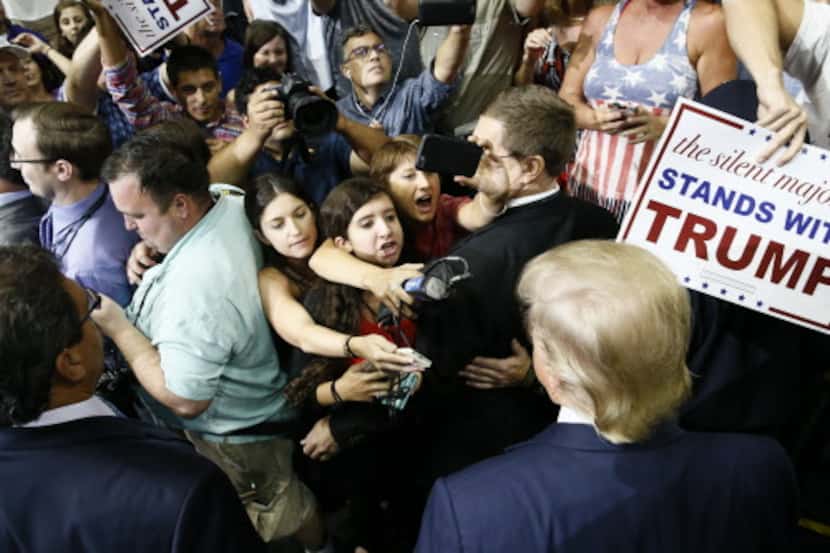  Republican presidential candidate Donald Trump mingles with reporters and onlookers after...
