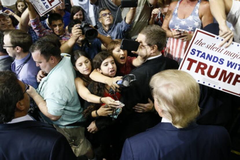  Republican presidential candidate Donald Trump mingles with reporters and onlookers after...