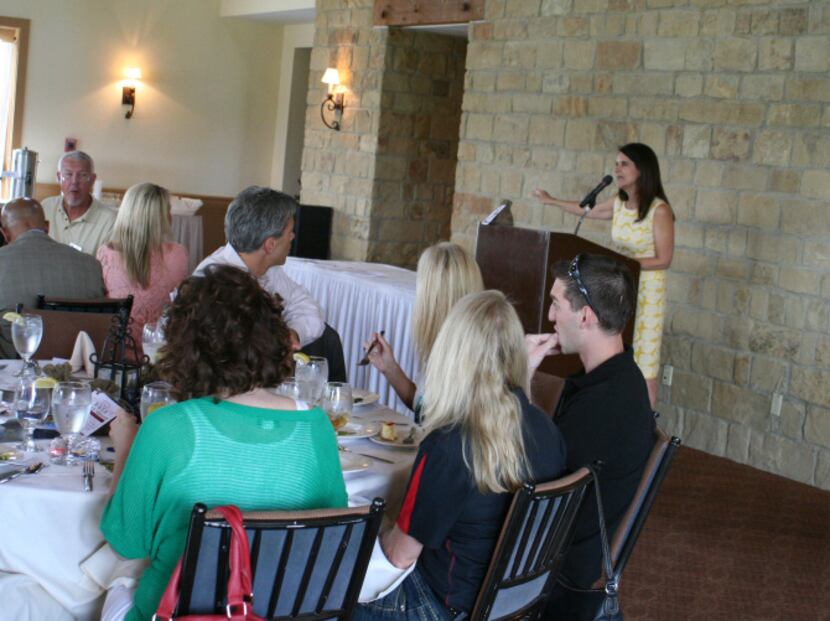 Walker speaks to the crowd at the chamber’s monthly luncheon Sept. 17 at Lantana Golf Club.