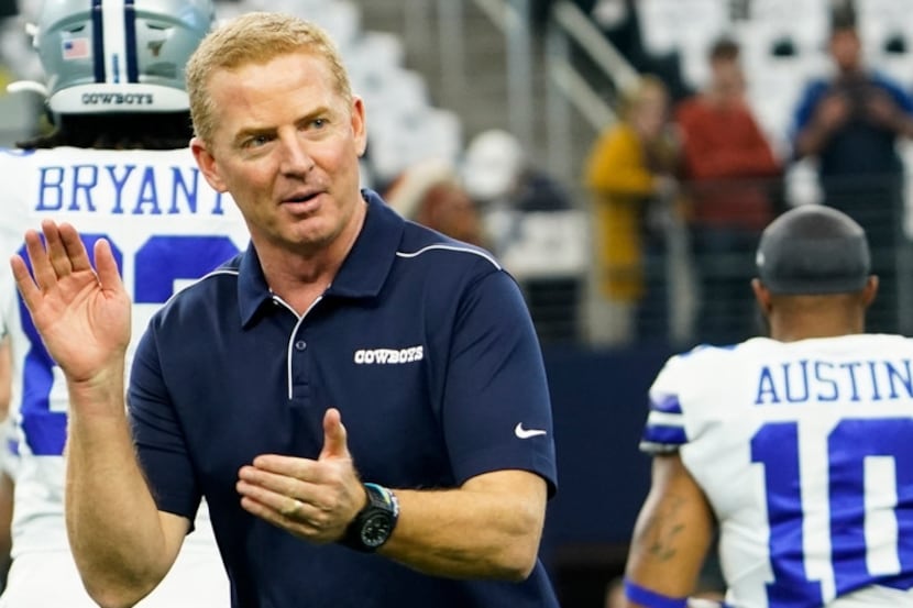 Dallas Cowboys head coach Jason Garrett encourages his team as they warm up before an NFL...