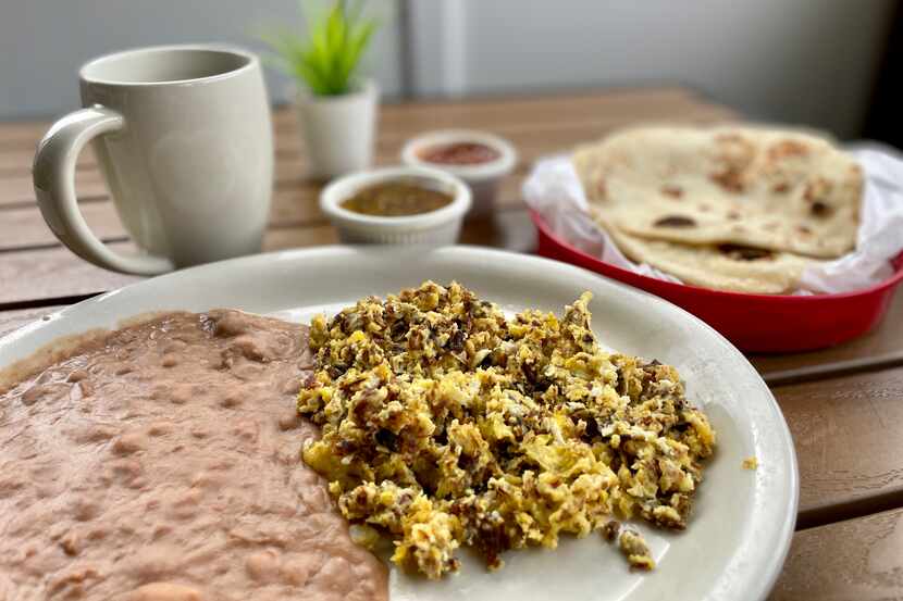 The best way to eat machaca or machacado is with scrambled eggs and refried beans, with...