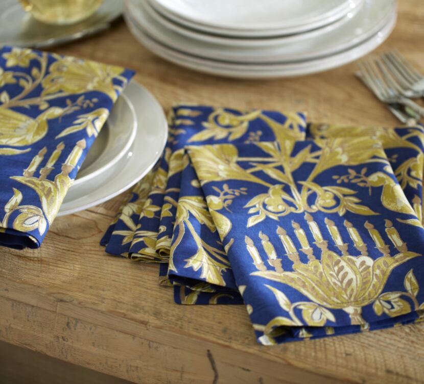 Napkins embroidered with metallic threads are $28/4 at Pottery Barn, 3212 Knox St. and the...