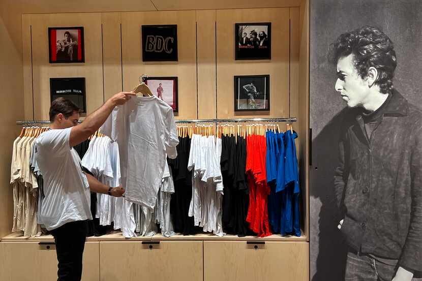 A visitor looks at T-shirts at the Bob Dylan Center gift shop in Tulsa. The center opened...
