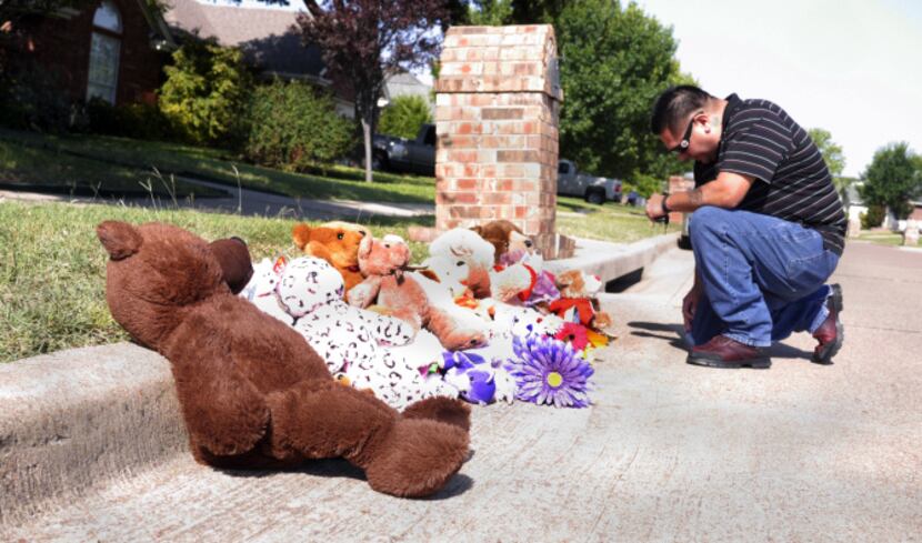 Fidencio Gallegos, who lives nearby, said a prayer Tuesday morning at the Saginaw memorial...