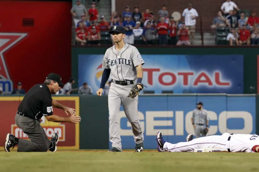 Texas Rangers catcher A.J. Pierzynski (12) is called out at second base by umpire Angel...