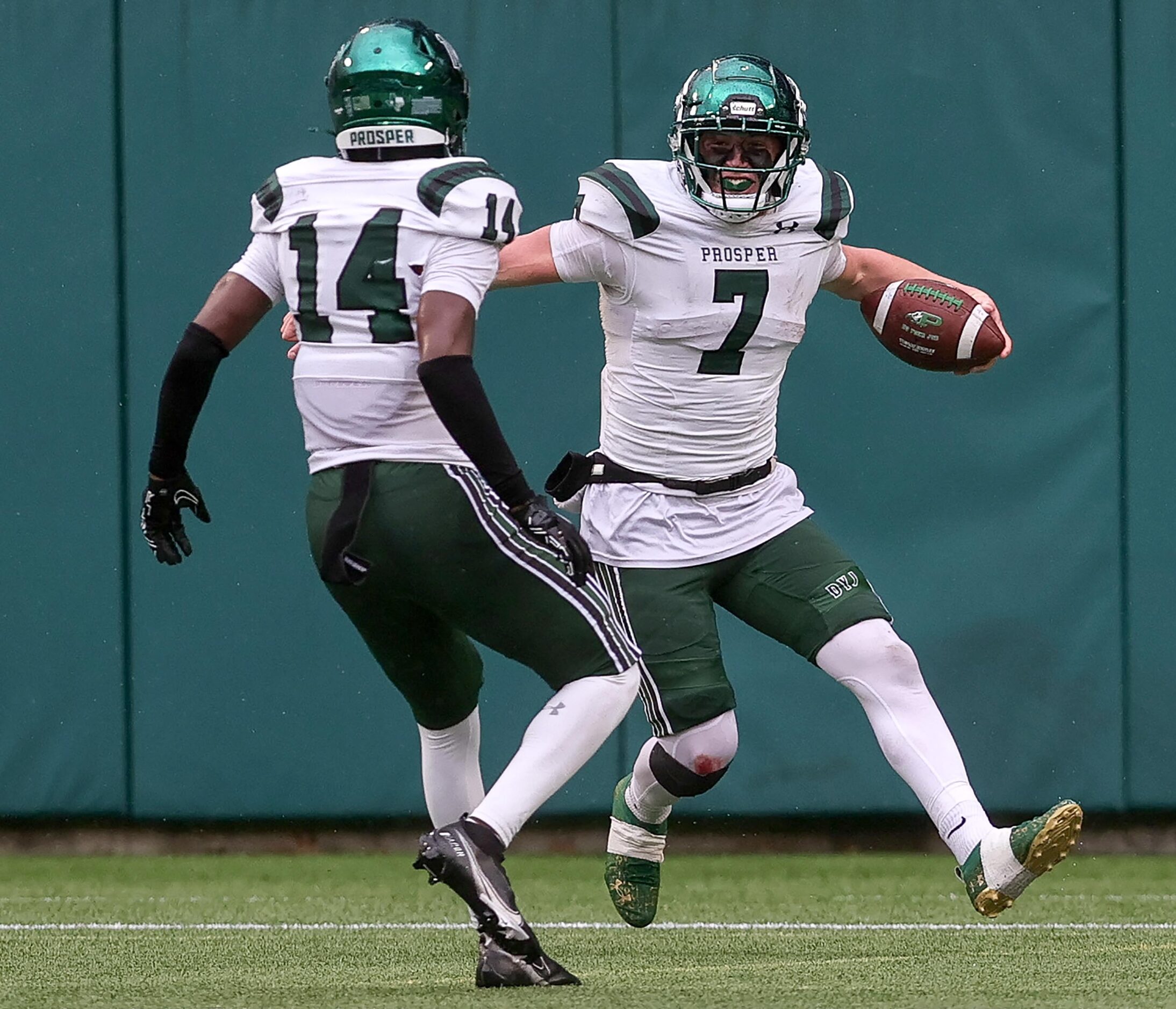 Prosper half back Brayden Rymer (7) and wide receiver Javan Henry (14) celebrate after...