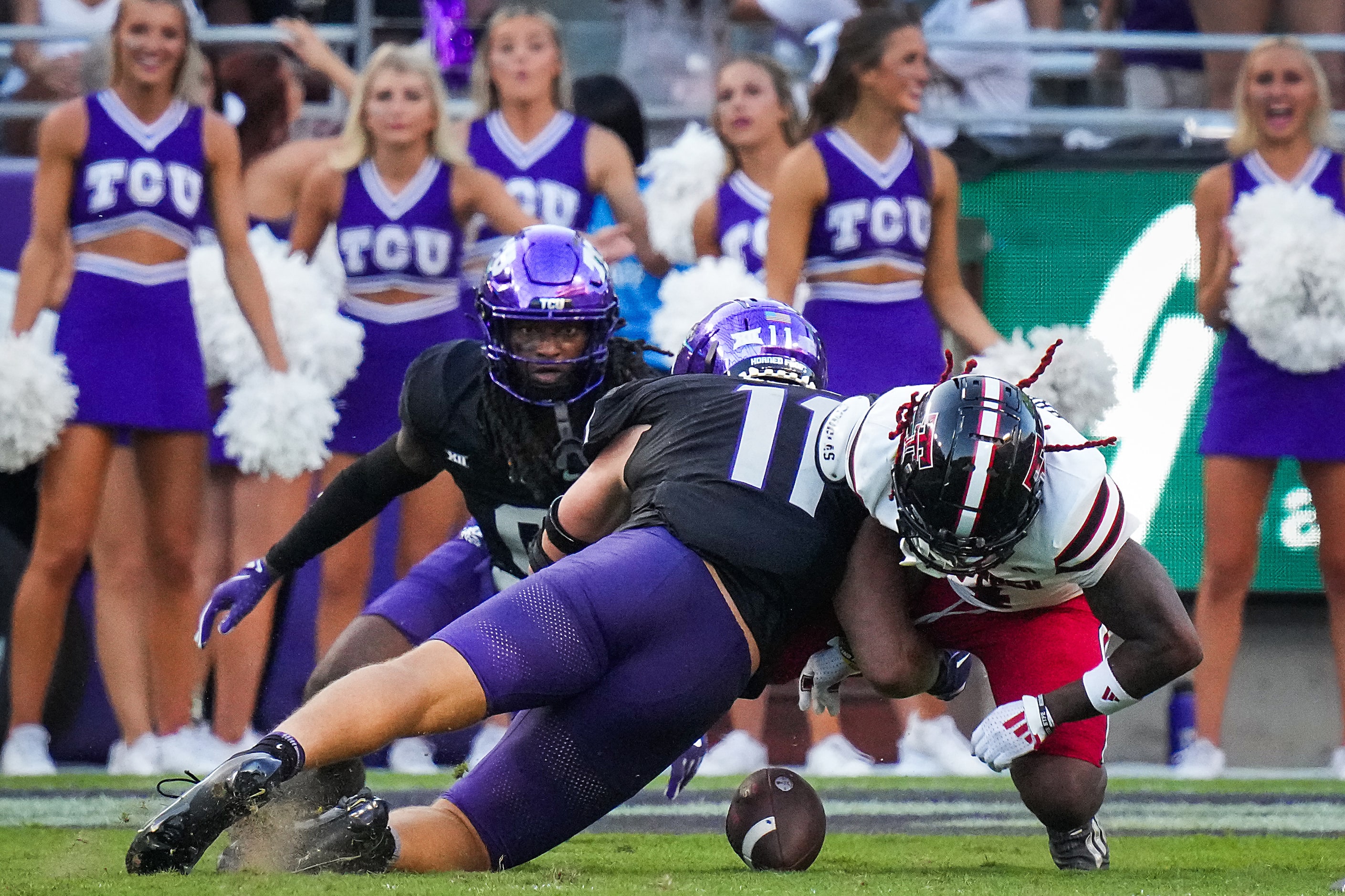 Texas Tech wide receiver Jordan Brown (4) fumbles on the final play of the game as he’s hit...