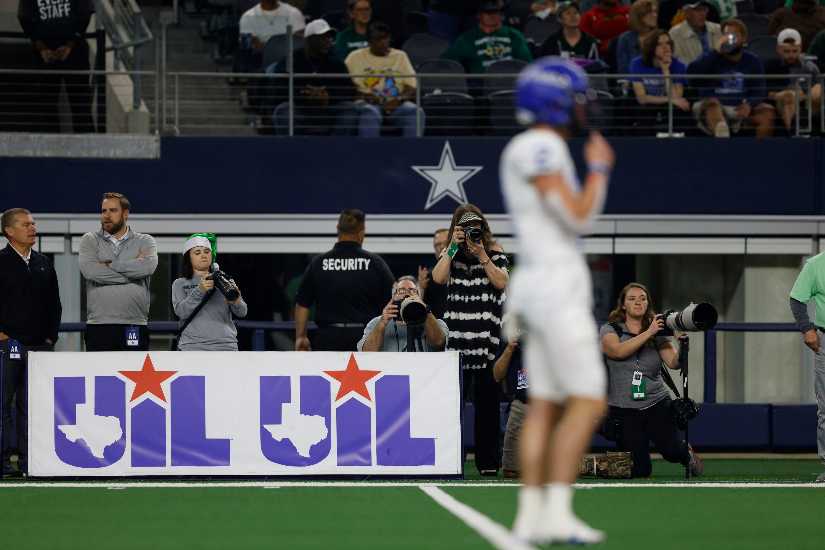 A University Interscholastic League banner sits alongside the sideline during the first...